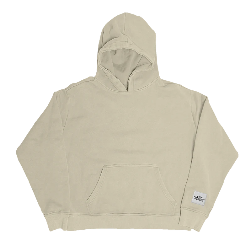 "Beige hoodie with a small white patch near the hem that reads 'Austin Post Malone © & ℗ 2023'."