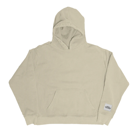 "Beige hoodie with a small white patch near the hem that reads 'Austin Post Malone © & ℗ 2023'."