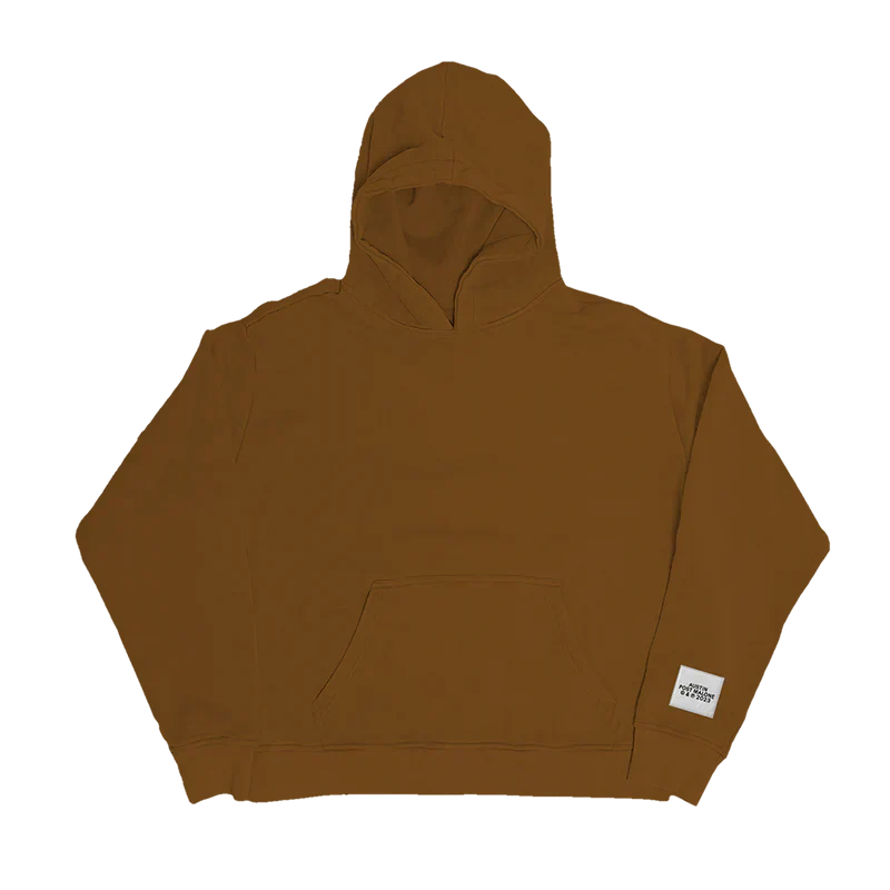 "Clay-colored hoodie with a small white patch near the hem that reads 'Austin Post Malone © & ℗ 2023'."