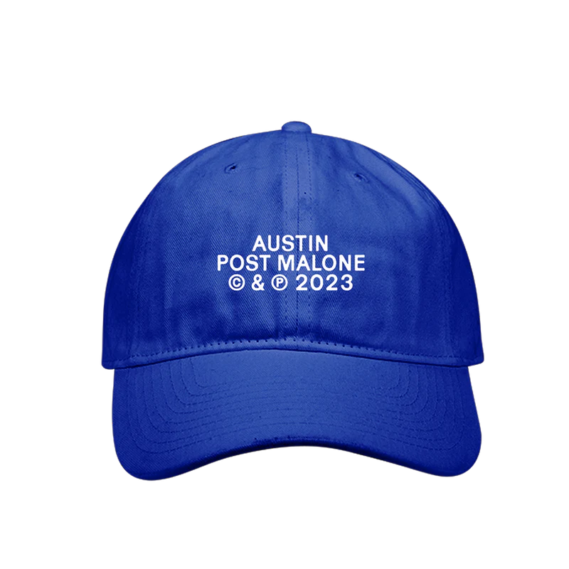 "Blue baseball cap with white text 'Austin Post Malone © & ℗ 2023' printed on the front."