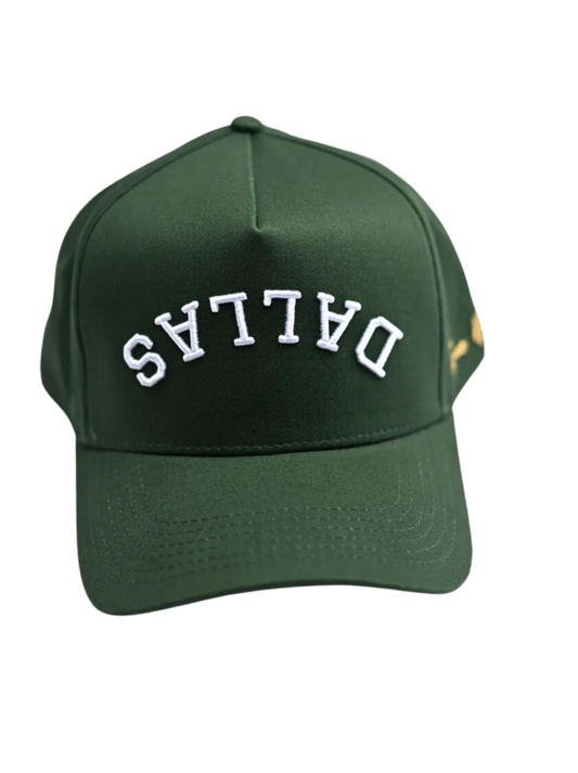 "Green baseball cap with the word 'Dallas' embroidered in white on the front."