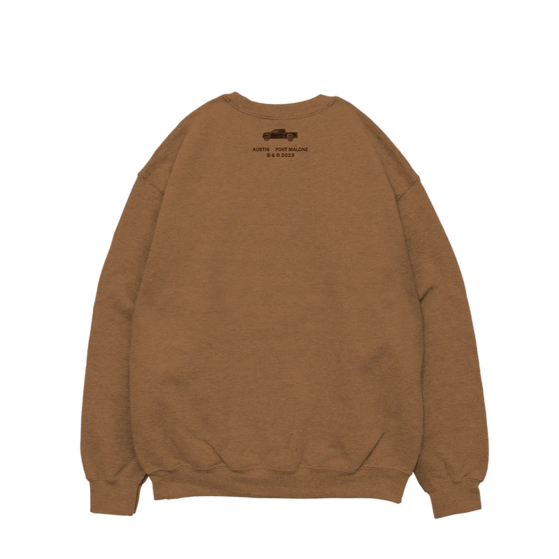 "Tan crewneck sweatshirt with a small black truck graphic and 'Austin Post Malone © & ℗ 2023' printed near the top."